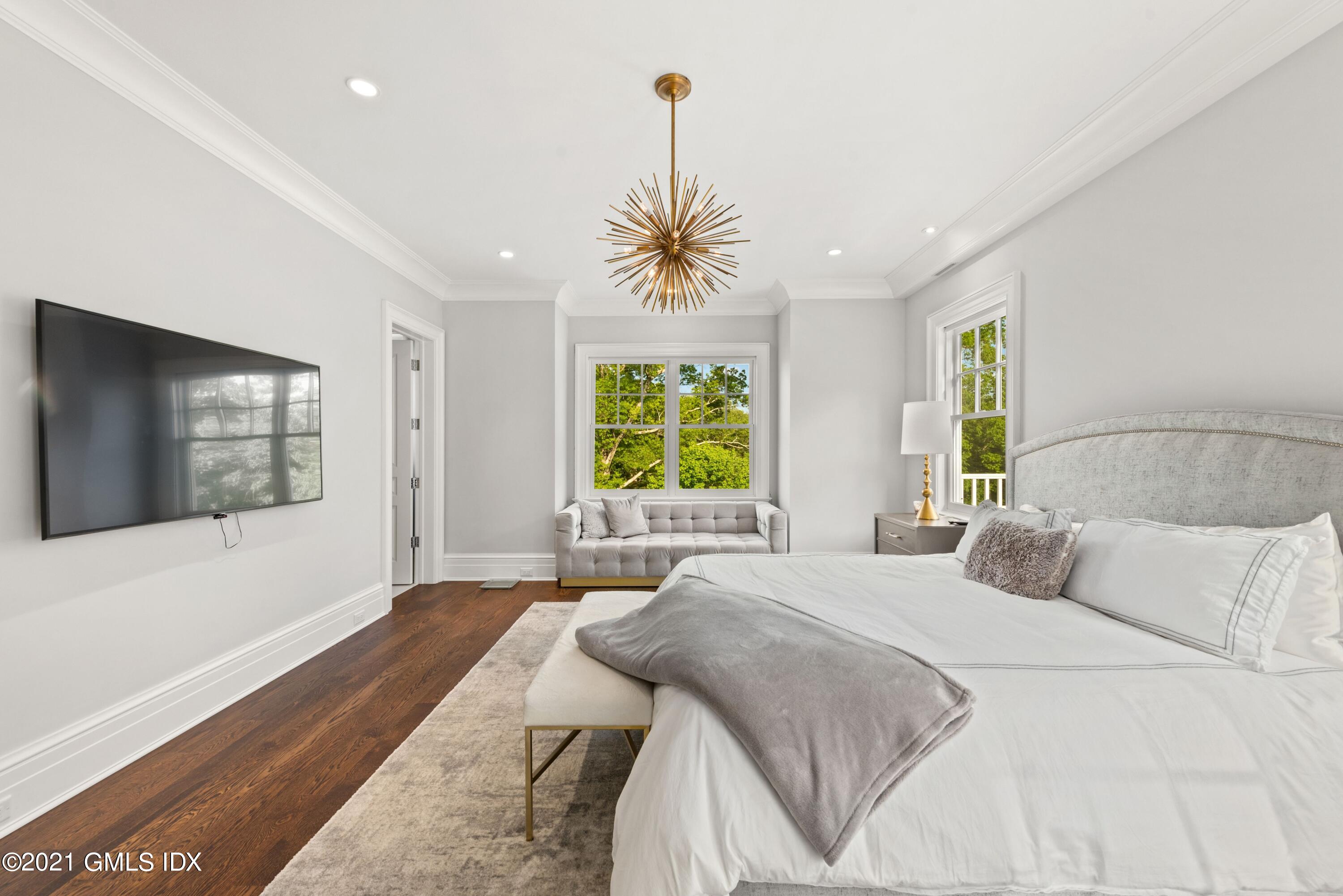 434 Riversville Road Greenwich, CT 06831 - Photo 25 of 47 a bedroom with a bed and a window