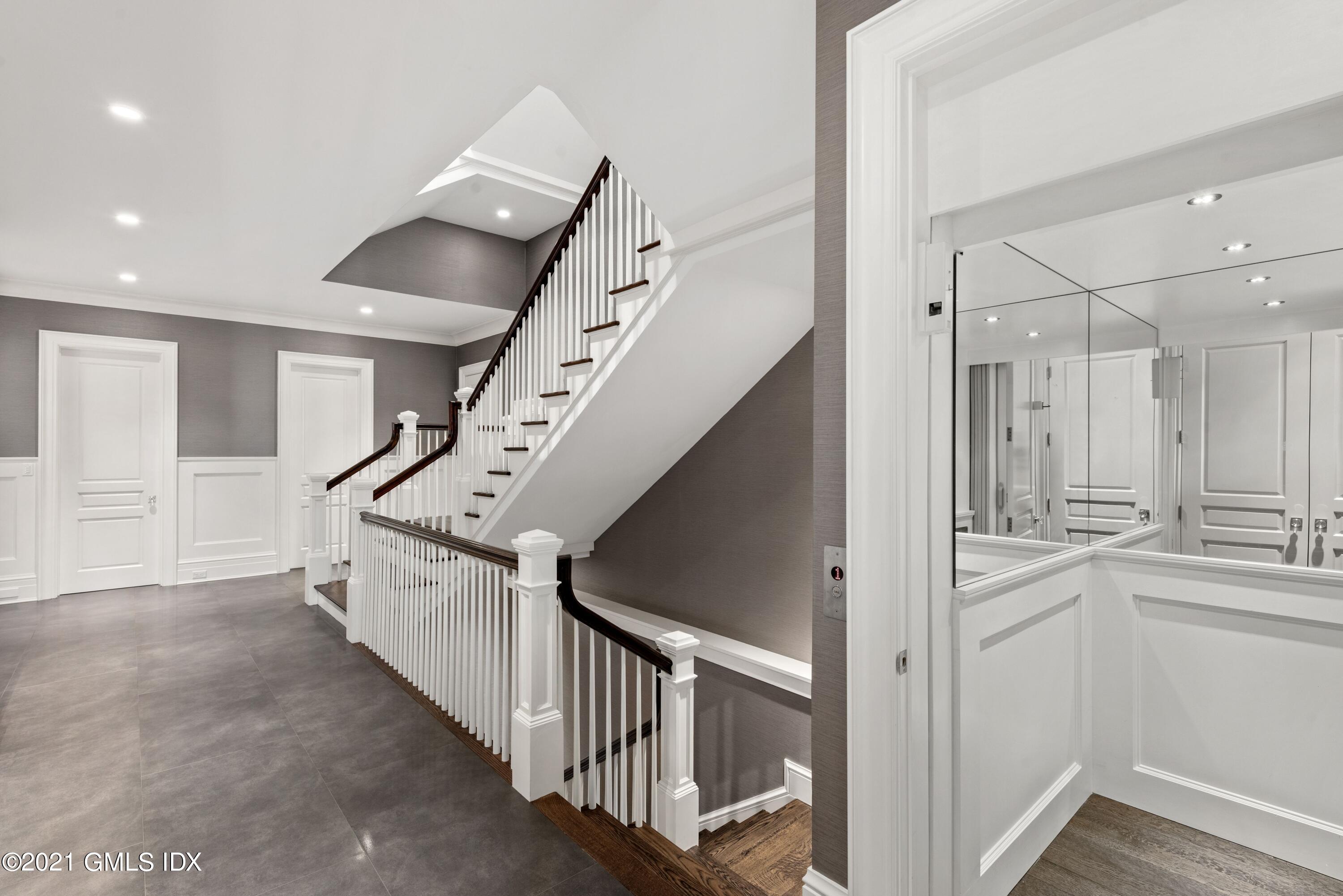 434 Riversville Road Greenwich, CT 06831 - Photo 26 of 47 a view of a hallway with entryway and stairs