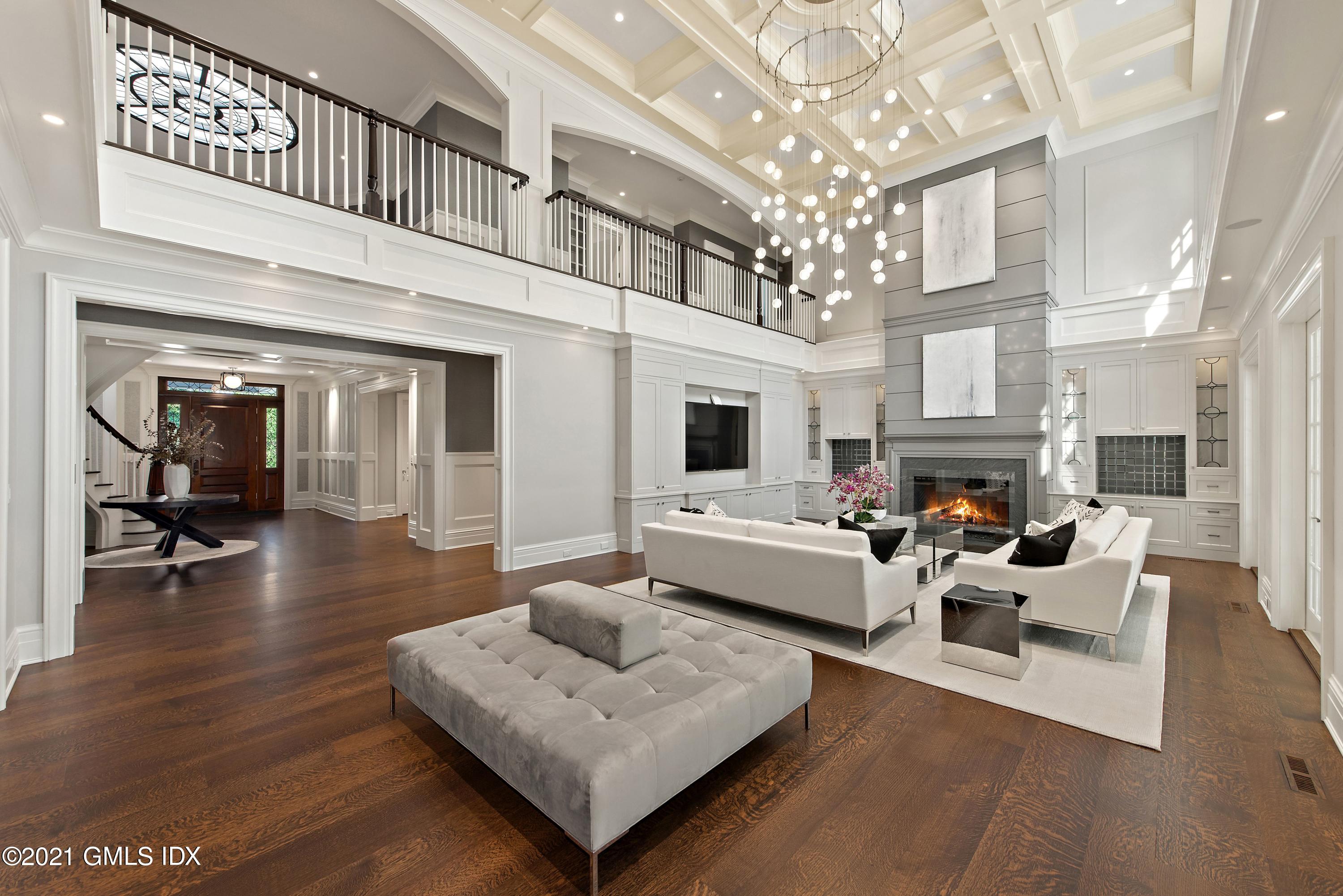 434 Riversville Road Greenwich, CT 06831 - Photo 5 of 47 a living room with fireplace furniture and a chandelier