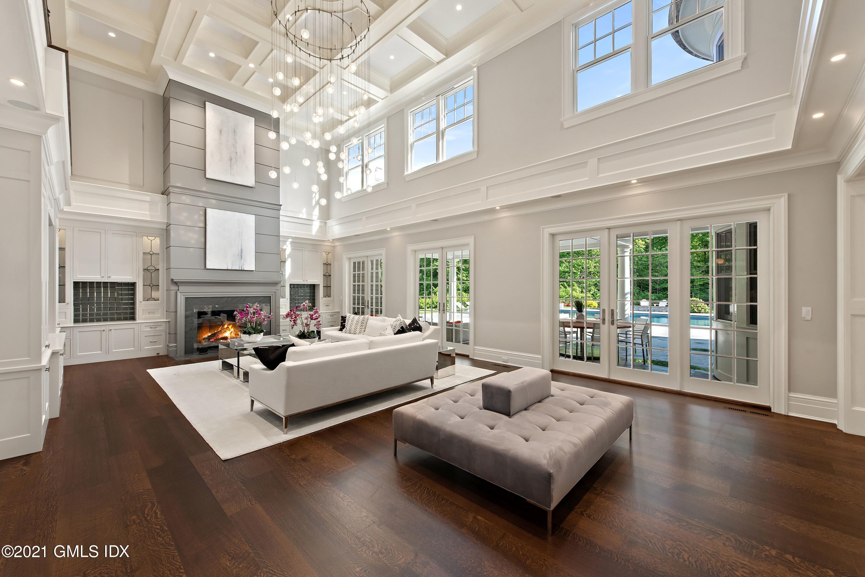 434 Riversville Road Greenwich, CT 06831 - Photo 6 of 47 a living room with furniture large window and wooden floor