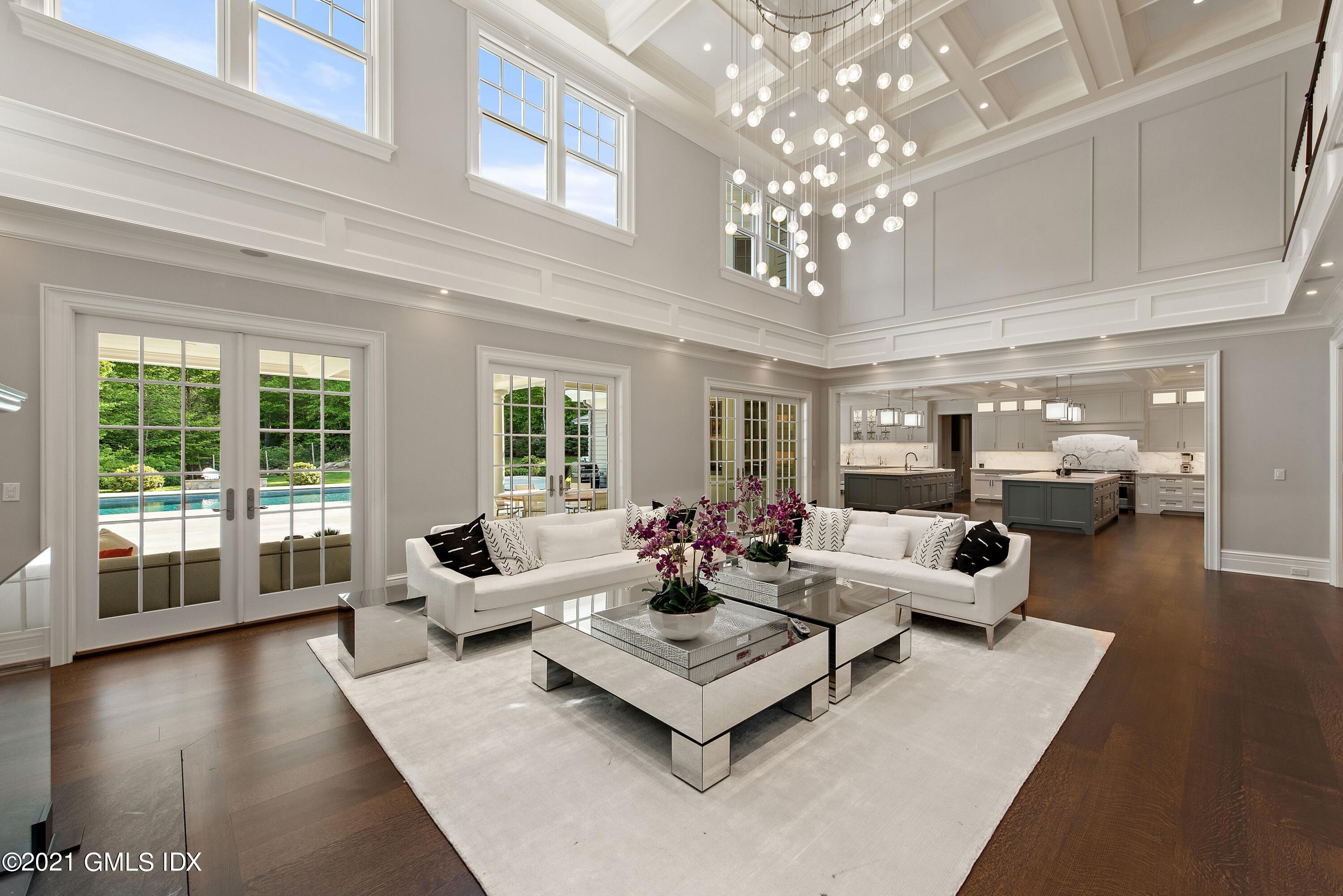 434 Riversville Road Greenwich, CT 06831 - Photo 9 of 47 a living room with furniture and a chandelier