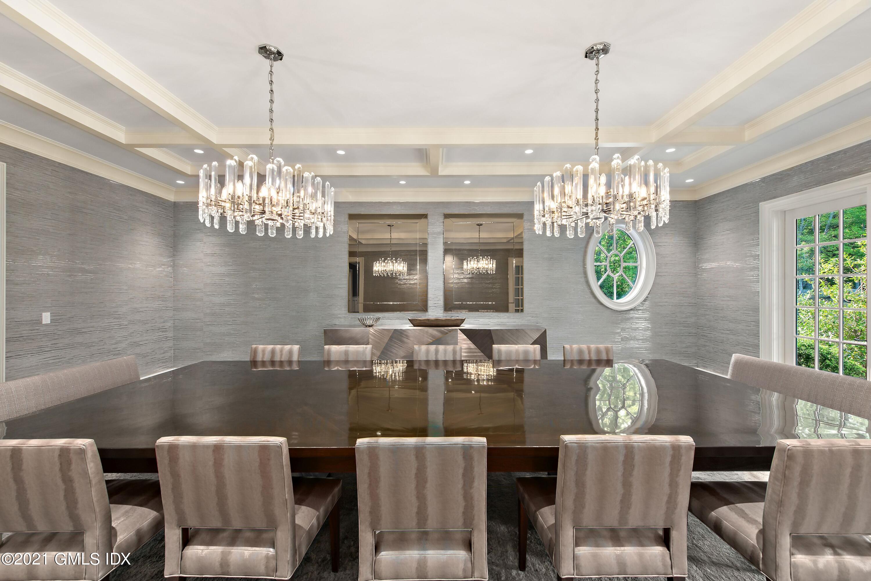 434 Riversville Road Greenwich, CT 06831 - Photo 10 of 47 a view of a dining room filled with furniture and chandelier