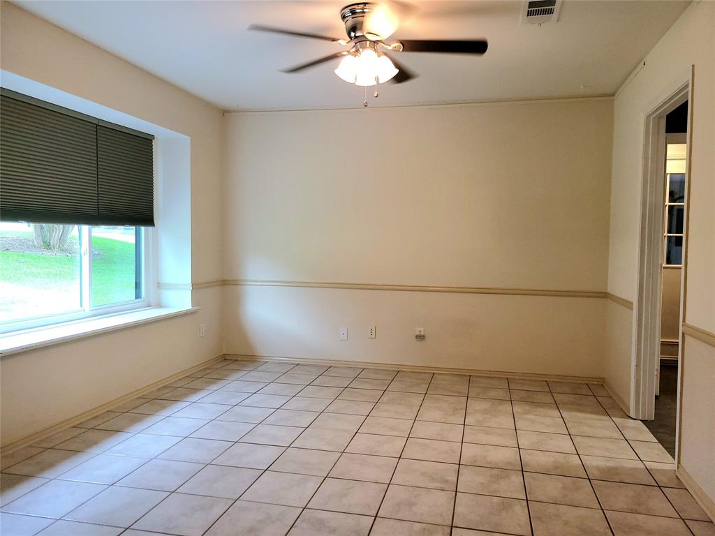 912 North Dove Road Grapevine, TX 76051 - Photo 4 of 36 a view of an empty room with a window
