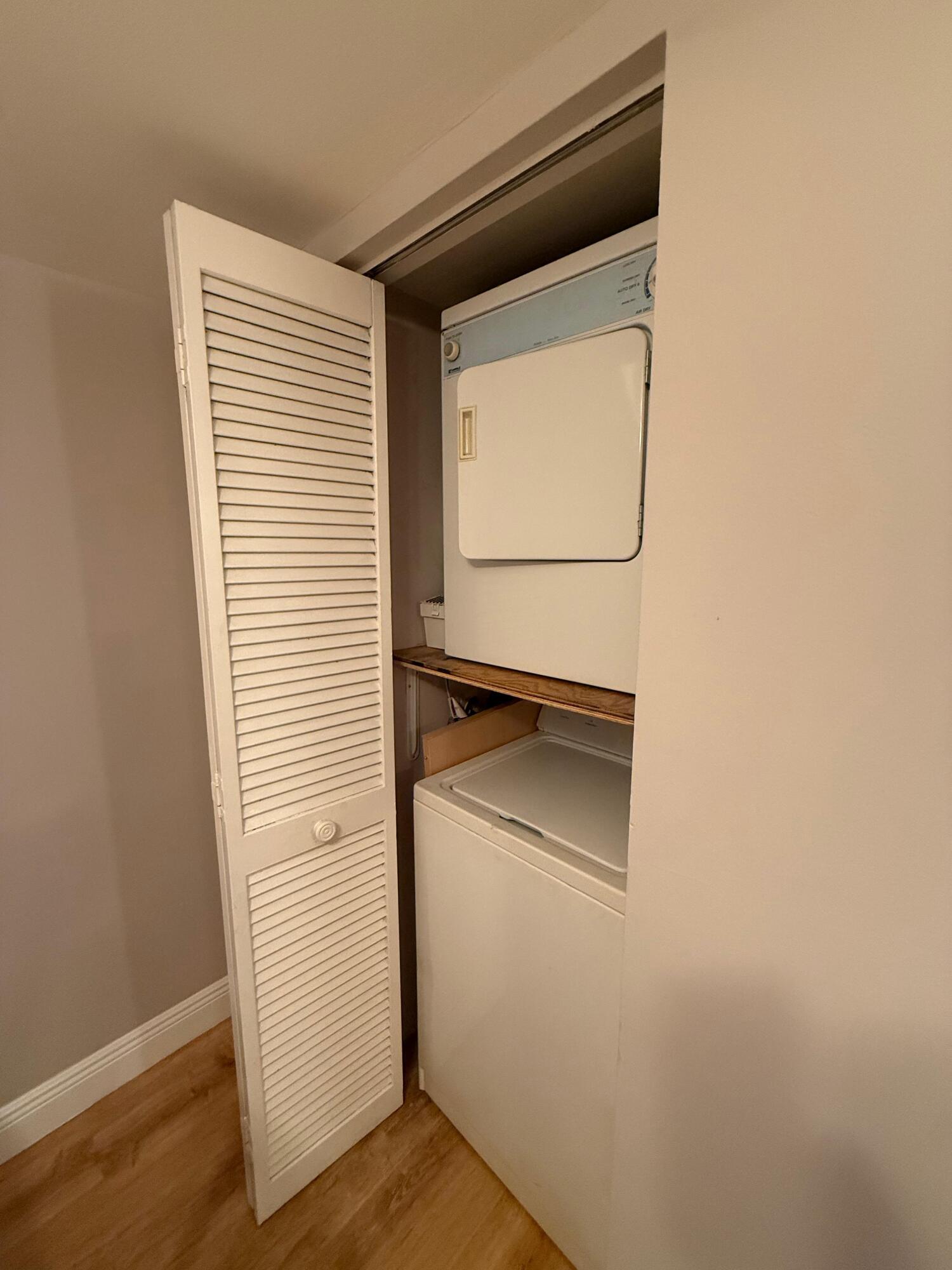 6372 La Costa Drive, Unit 306 Boca Raton, FL 33433 - Photo 10 of 23 a room with a door and wooden floor