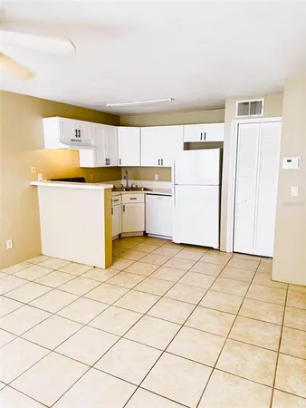 a kitchen with a cabinets and appliances