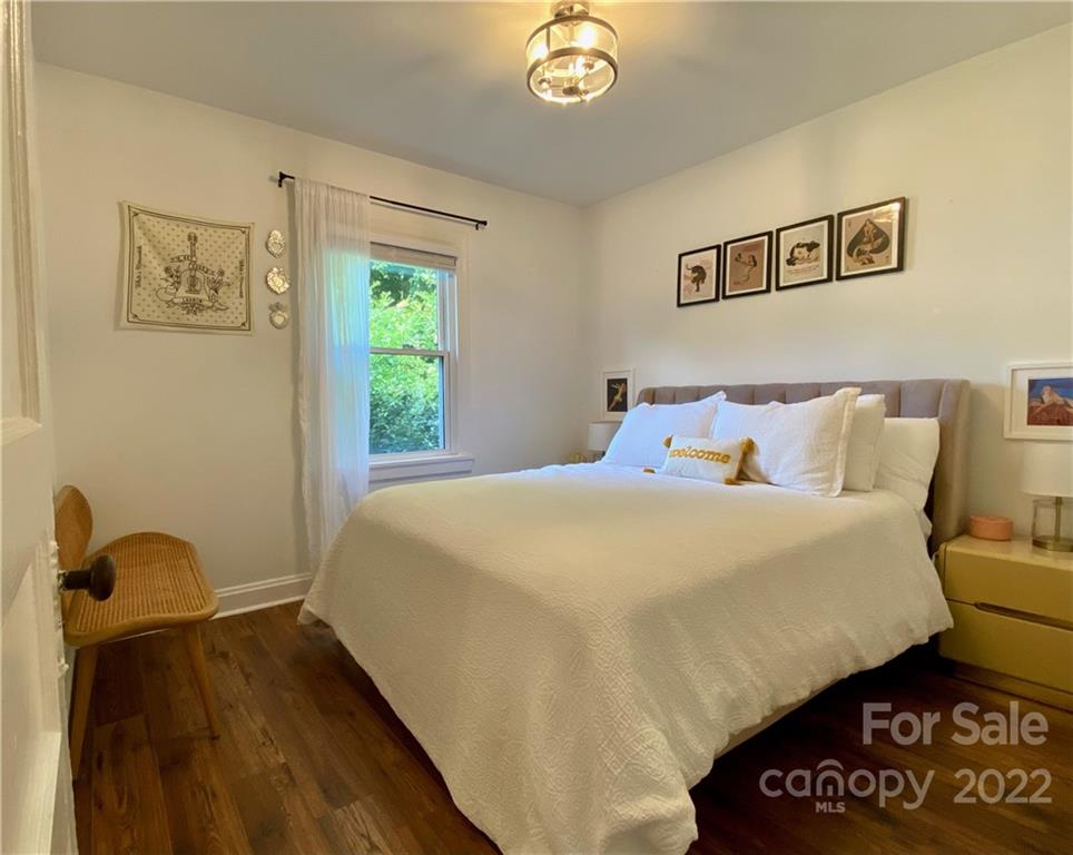 1240 Skyview Road Charlotte, NC 28208 - Photo 11 of 30 a bedroom with a bed and a painting on the wall