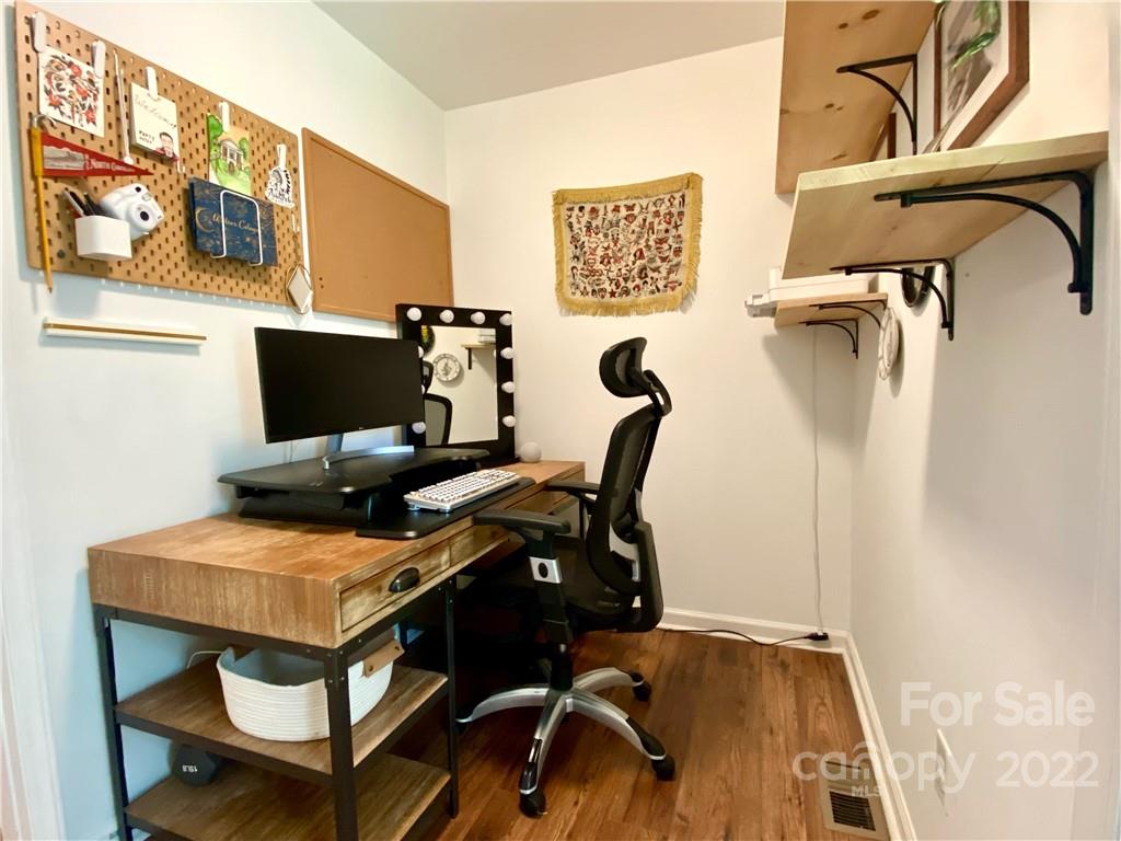 1240 Skyview Road Charlotte, NC 28208 - Photo 17 of 30 a view of a workspace with furniture and a window