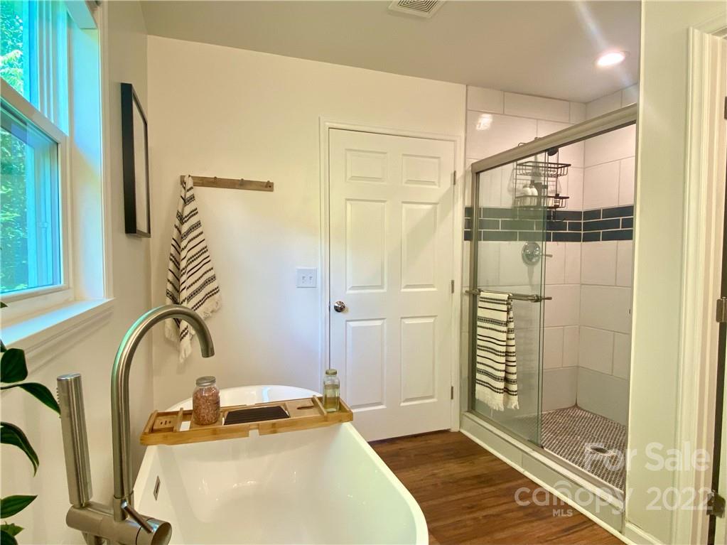 1240 Skyview Road Charlotte, NC 28208 - Photo 19 of 30 a bathroom with a sink and a mirror