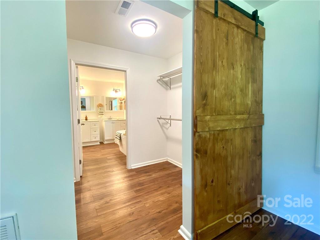 1240 Skyview Road Charlotte, NC 28208 - Photo 21 of 30 a view of a bathroom with a glass door