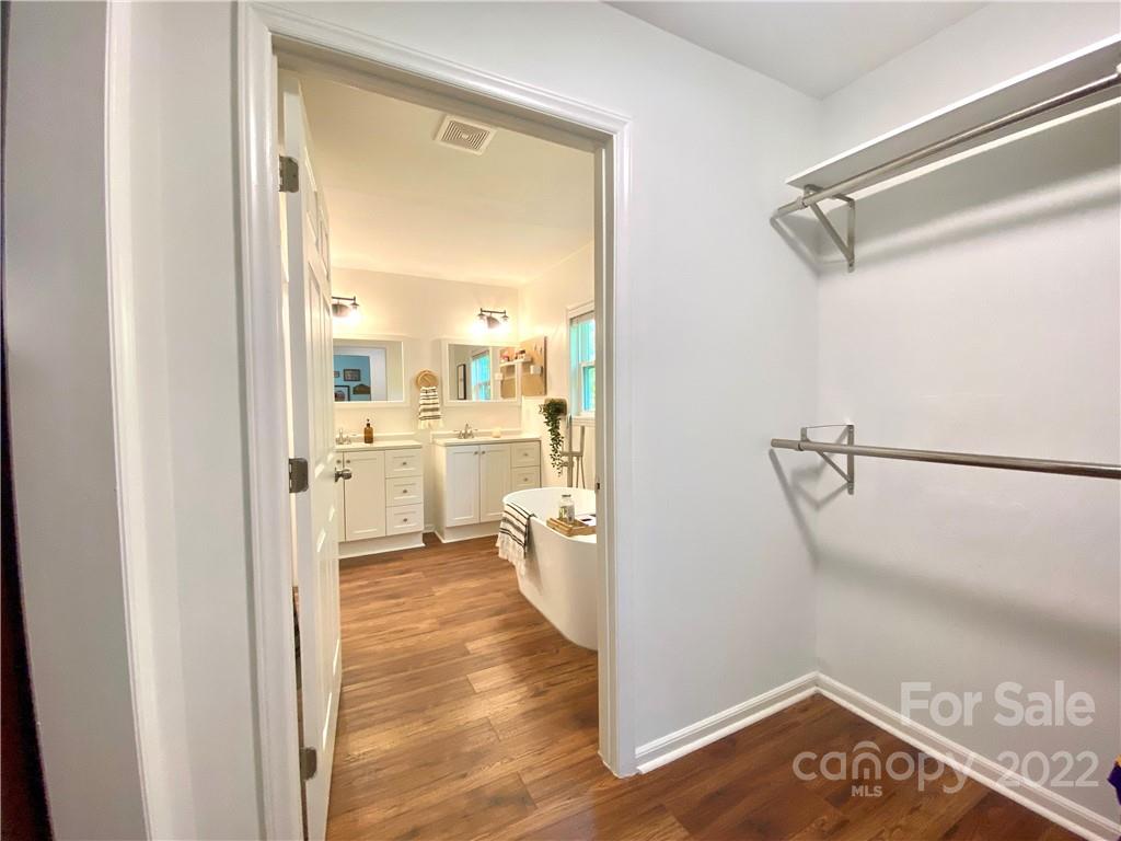 1240 Skyview Road Charlotte, NC 28208 - Photo 22 of 30 a view of a walk in closet and bedroom