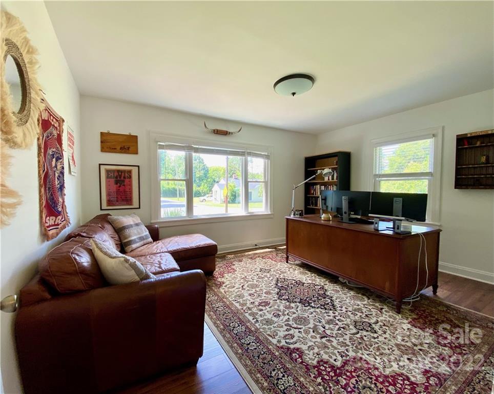 1240 Skyview Road Charlotte, NC 28208 - Photo 23 of 30 a living room with furniture and a flat screen tv