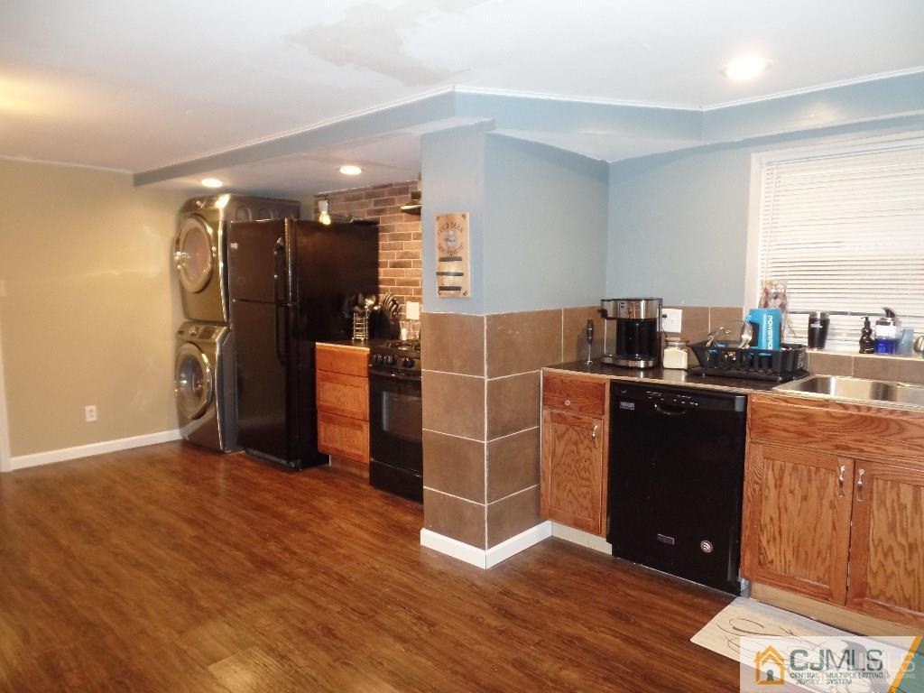 85 Jordan Road Colonia, NJ 07067 - Photo 3 of 17 a kitchen with stainless steel appliances granite countertop a refrigerator and a stove top oven