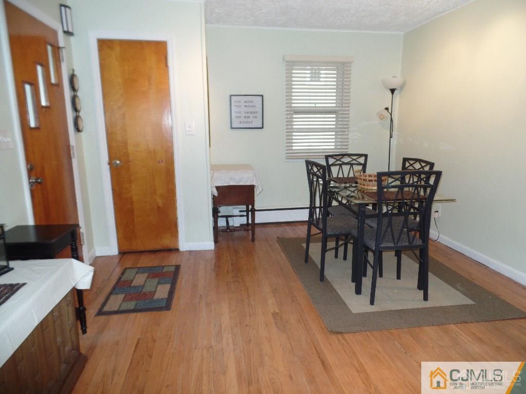 85 Jordan Road Colonia, NJ 07067 - Photo 6 of 17 a view of a dining room with furniture and wooden floor