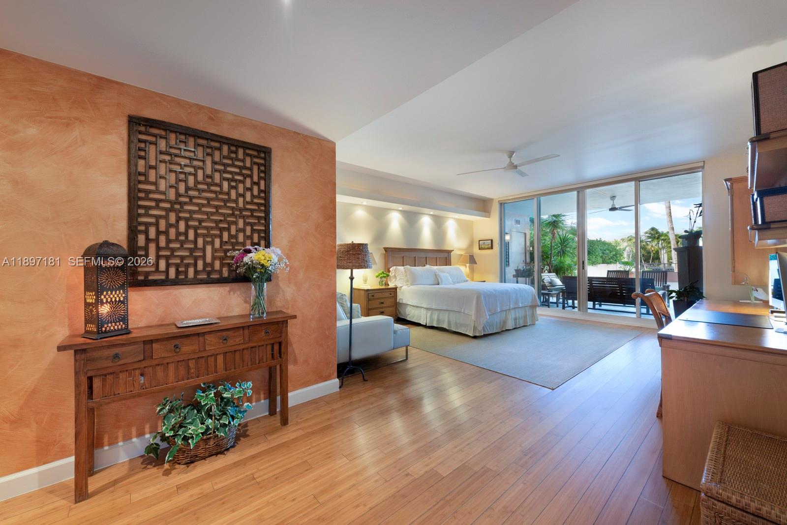 765 Crandon Boulevard, Unit 102 Key Biscayne, FL 33149 - Photo 14 of 37 a living room with furniture floor to ceiling window and wooden floor