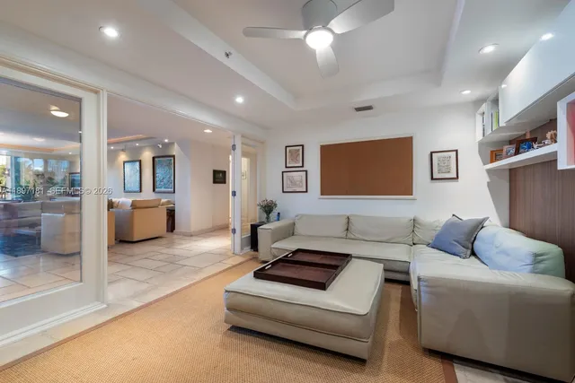 a bedroom with furniture and a flat screen tv