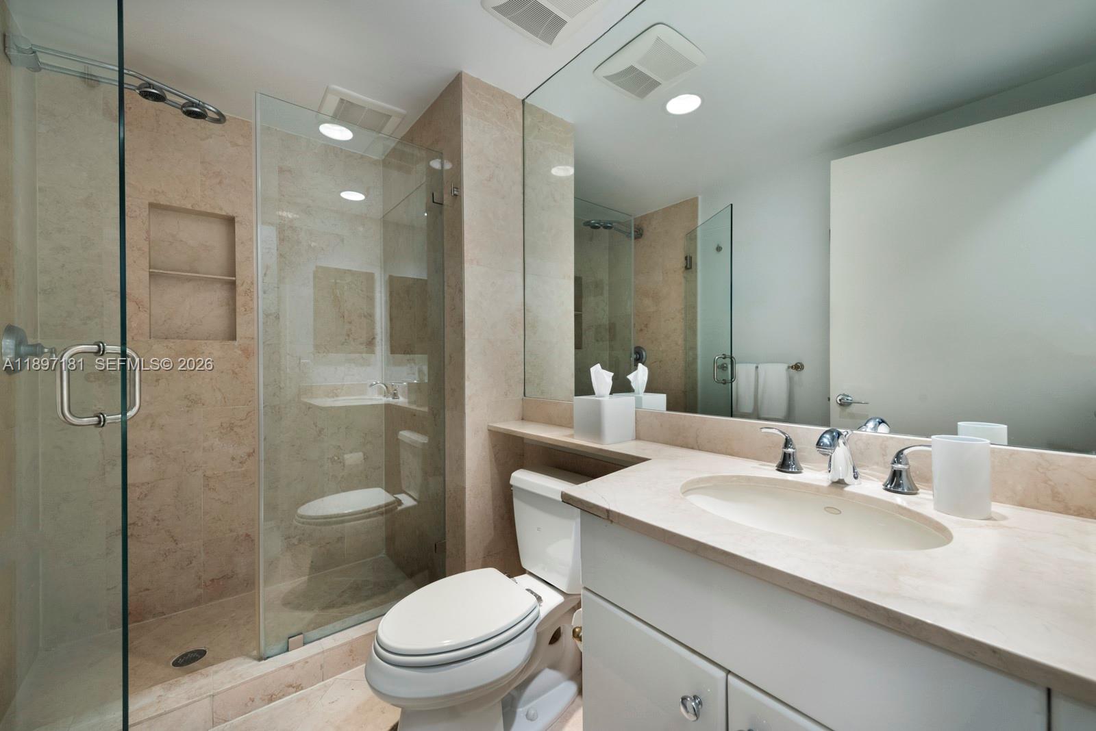 765 Crandon Boulevard, Unit 102 Key Biscayne, FL 33149 - Photo 22 of 37 a bathroom with a sink toilet and shower