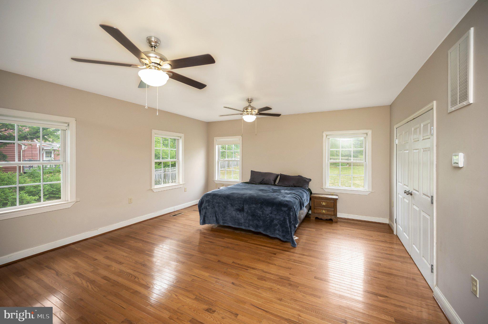 23202 Village Road Unionville, VA 22567 - Photo 18 of 58 a living room with a bed furniture and a window