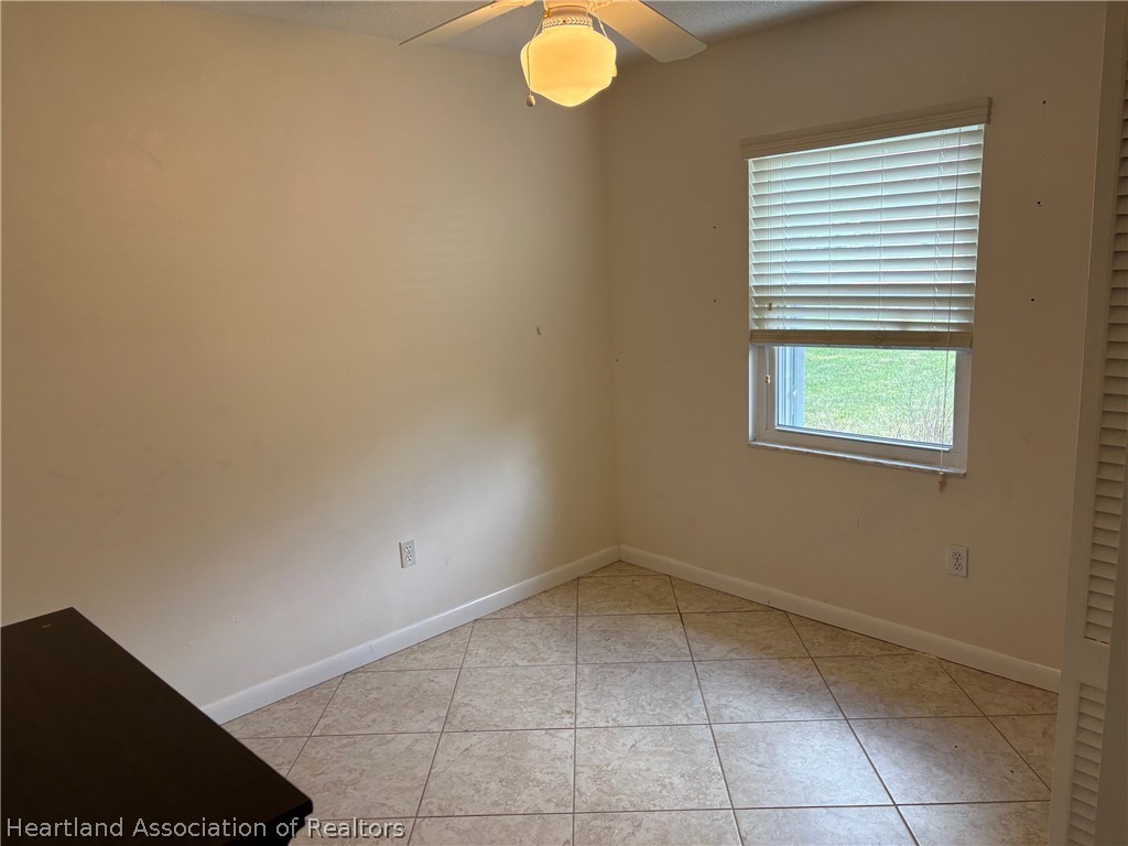 3913 Ferrari Drive Sebring, FL 33872 - Photo 9 of 20 a view of a kitchen with a empty space and a window
