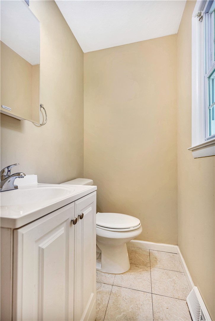 2011 Forest Drive Seneca, SC 29672 - Photo 26 of 36 A well-appointed powder room features practical vanity storage and a clean, neutral palette.