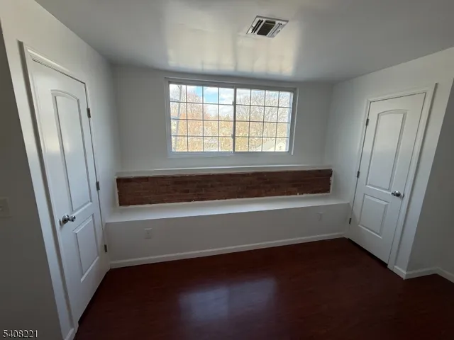 a bathroom with a sink toilet and mirror