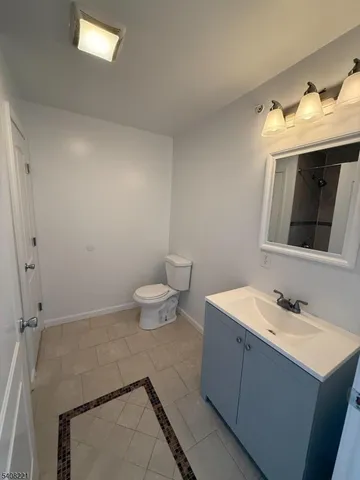 a bathroom with a tub and shower