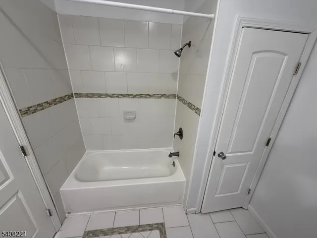 a white bath tub sitting in a bathroom