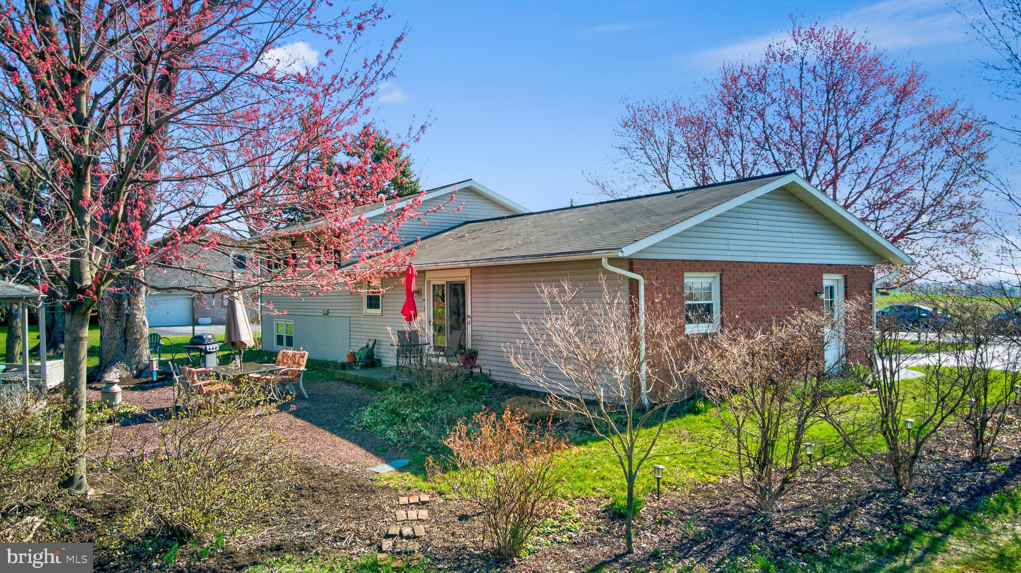 7 Buch Mill Road Lititz, PA 17543 - Photo 41 of 56 a front view of a house with garden