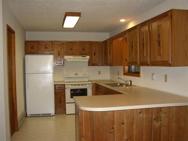 2506 Inverhouse Road Henryville, PA 18332 - Photo 7 of 8 a kitchen with a stove a refrigerator and a sink