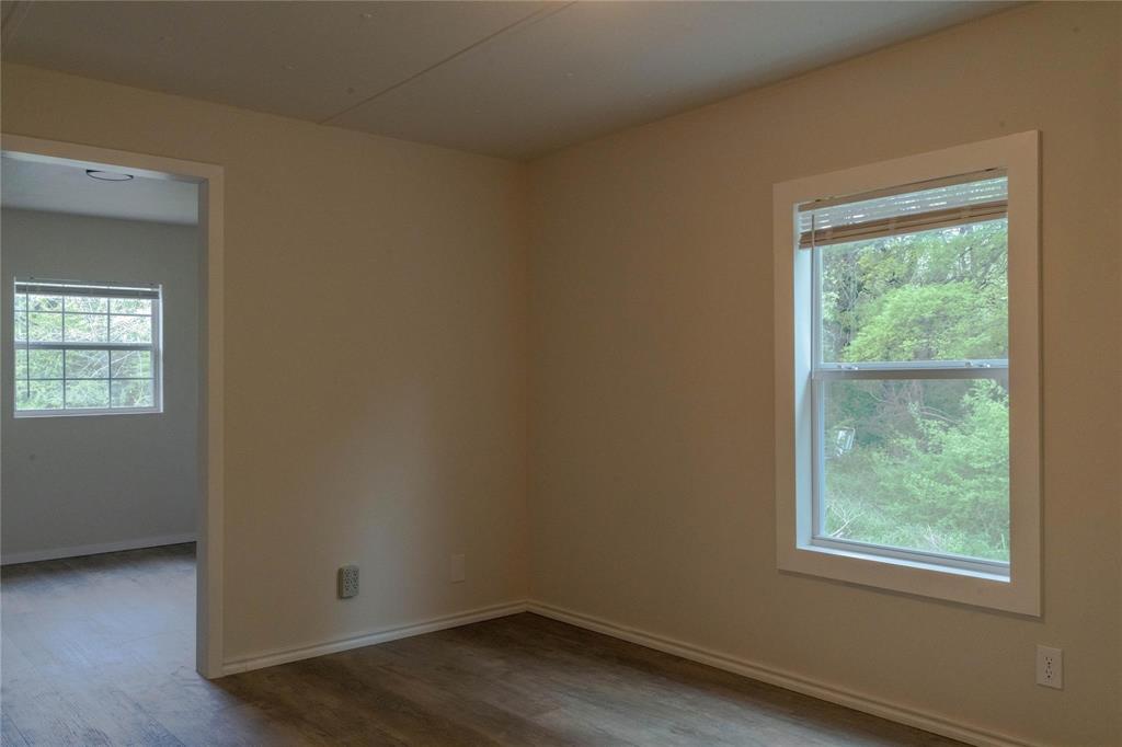 4817 Creekside Road Melissa, TX 75454 - Photo 6 of 10 an empty room with a window