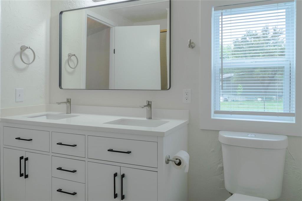 4817 Creekside Road Melissa, TX 75454 - Photo 8 of 10 a bathroom with a sink and a toilet