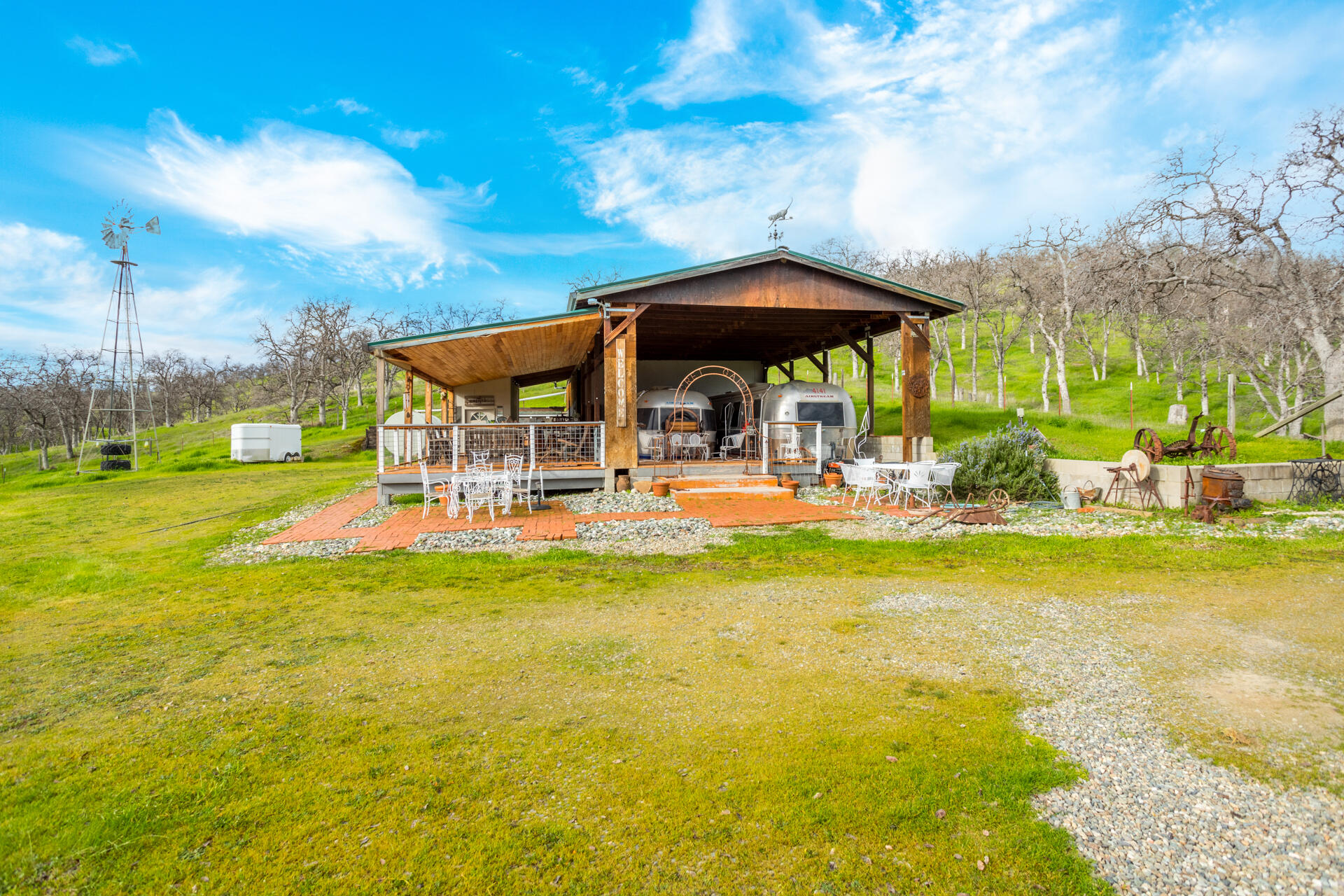 10333 Trinity Alps Vista Road Igo, CA 96047 - Photo 23 of 31 a view of swimming pool with lawn chairs under an umbrella