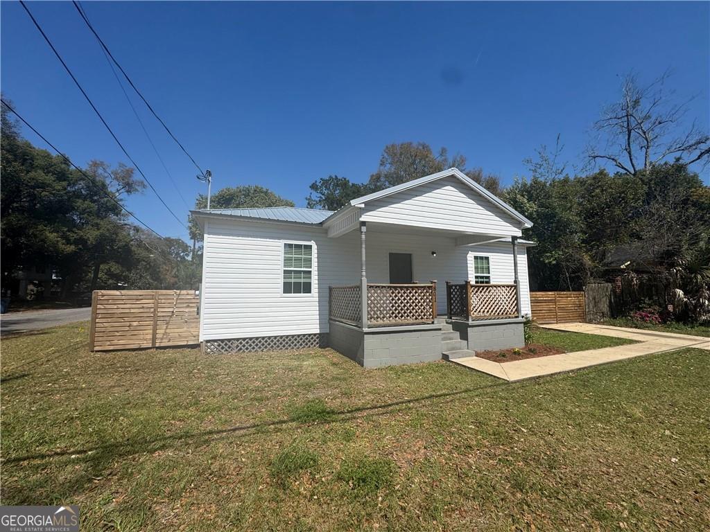 801 R Street Brunswick, GA 31520 - Photo 1 of 26 a front view of a house with a yard