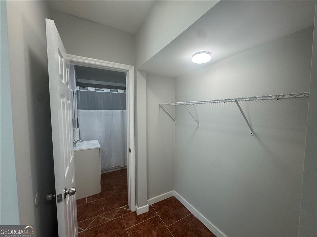 801 R Street Brunswick, GA 31520 - Photo 22 of 26 a bathroom with a shower and a sink