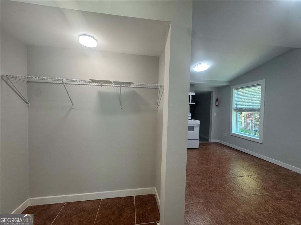801 R Street Brunswick, GA 31520 - Photo 9 of 26 a view of a room with wooden floor and a window