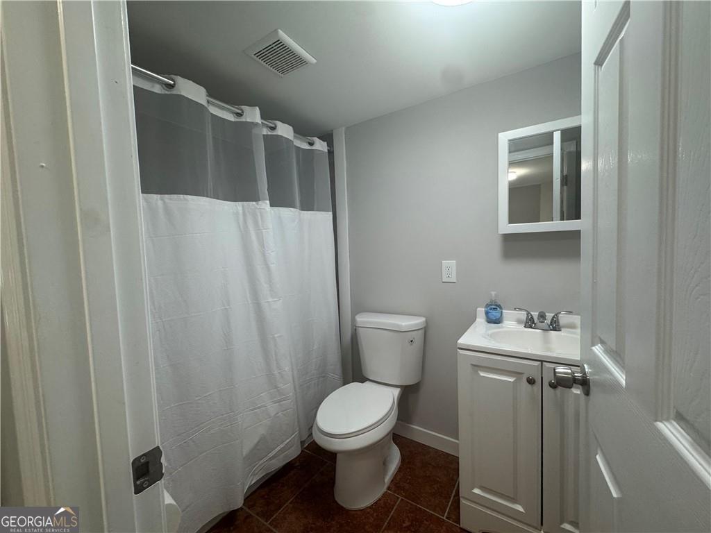 801 R Street Brunswick, GA 31520 - Photo 10 of 26 a bathroom with a sink toilet and shower
