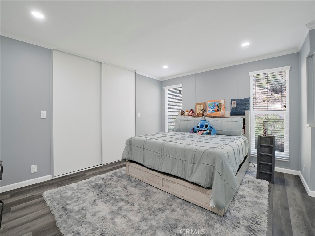 24303 Woolsey Canyon Road, Unit 85 West Hills, CA 91304 - Photo 11 of 31 a bedroom with a bed and a window