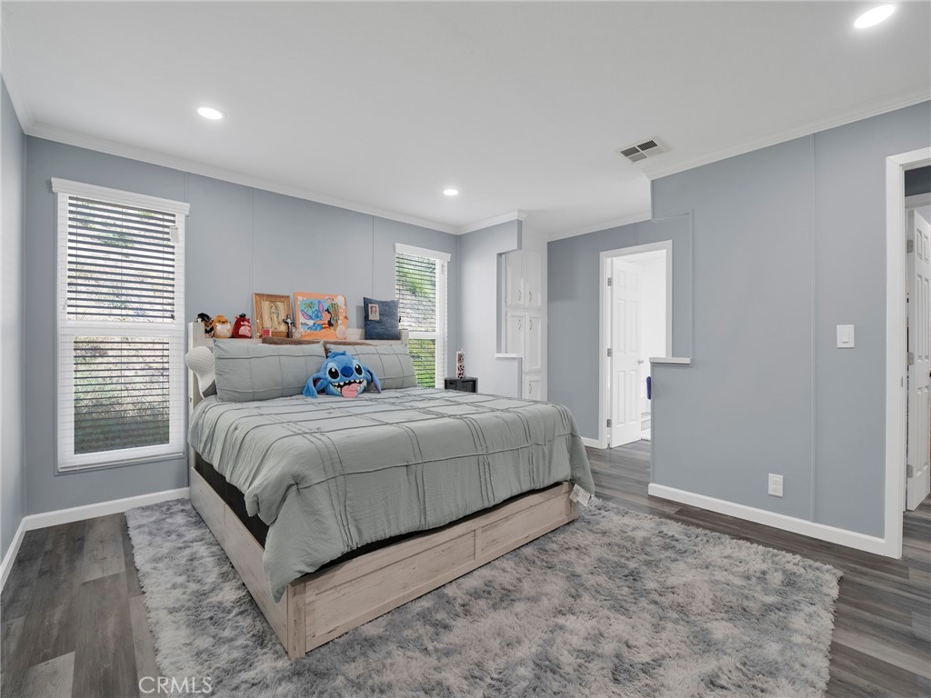 24303 Woolsey Canyon Road, Unit 85 West Hills, CA 91304 - Photo 12 of 31 a bedroom with a large bed and a window