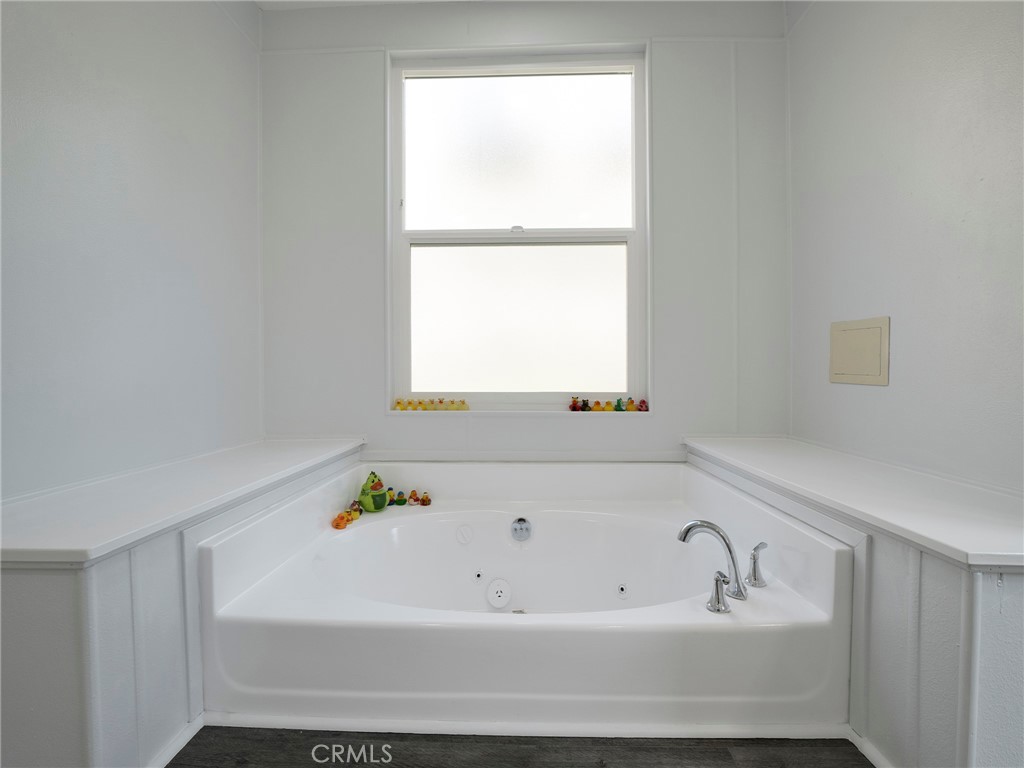 24303 Woolsey Canyon Road, Unit 85 West Hills, CA 91304 - Photo 14 of 31 a bathroom with a bathtub