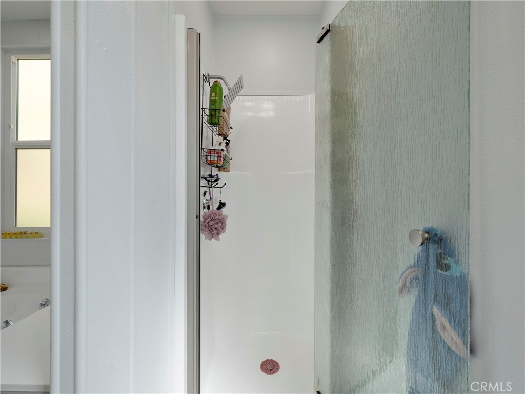 24303 Woolsey Canyon Road, Unit 85 West Hills, CA 91304 - Photo 15 of 31 a bathroom with a shower