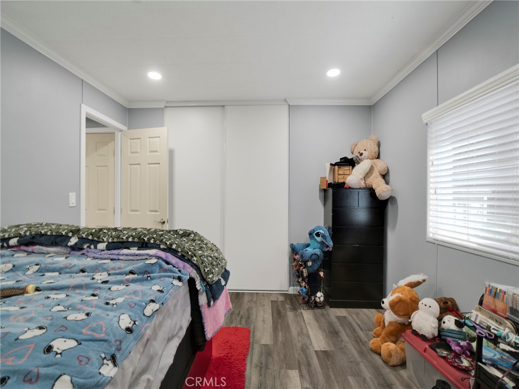 24303 Woolsey Canyon Road, Unit 85 West Hills, CA 91304 - Photo 17 of 31 a bedroom with a bed and a window