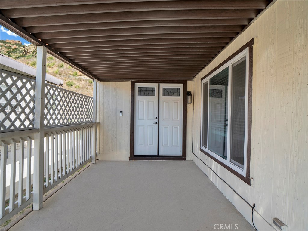 24303 Woolsey Canyon Road, Unit 85 West Hills, CA 91304 - Photo 23 of 31 a view of a porch