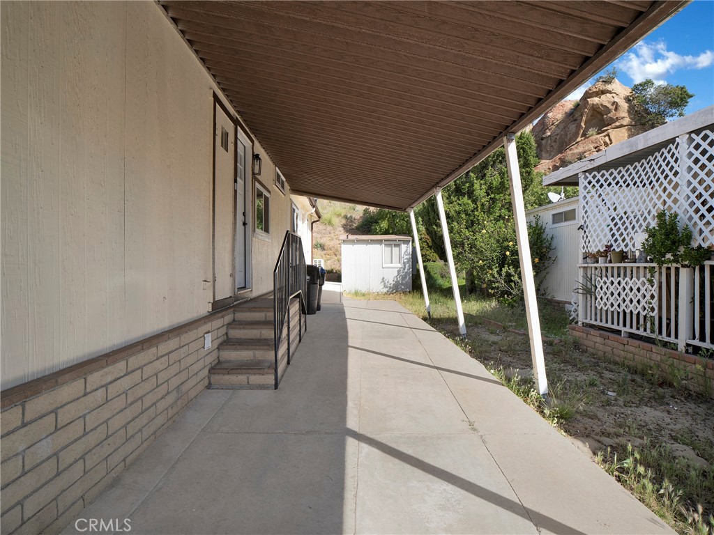 24303 Woolsey Canyon Road, Unit 85 West Hills, CA 91304 - Photo 25 of 31 a house view with a backyard
