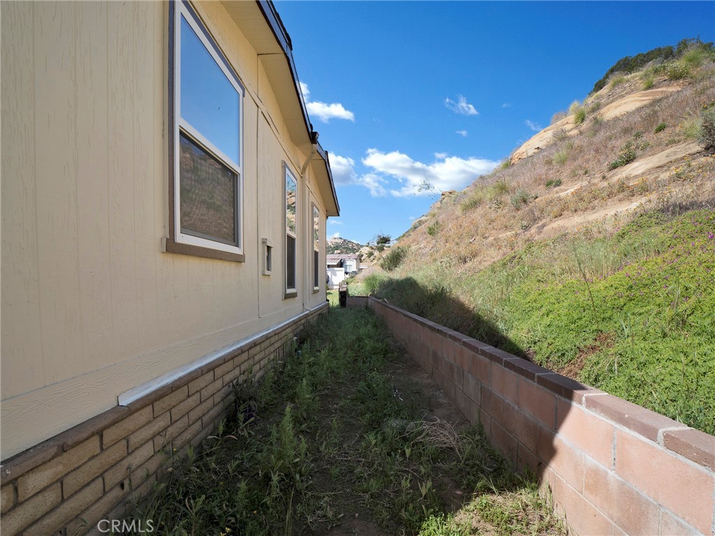 24303 Woolsey Canyon Road, Unit 85 West Hills, CA 91304 - Photo 27 of 31 a view of a backyard with plants