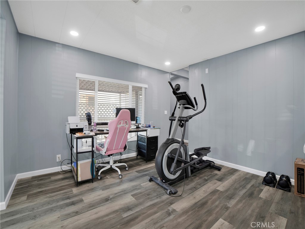 24303 Woolsey Canyon Road, Unit 85 West Hills, CA 91304 - Photo 8 of 31 a view of a room with gym equipment
