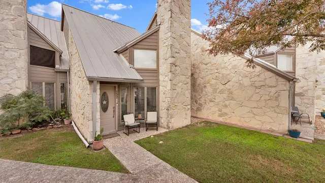 a view of house with backyard