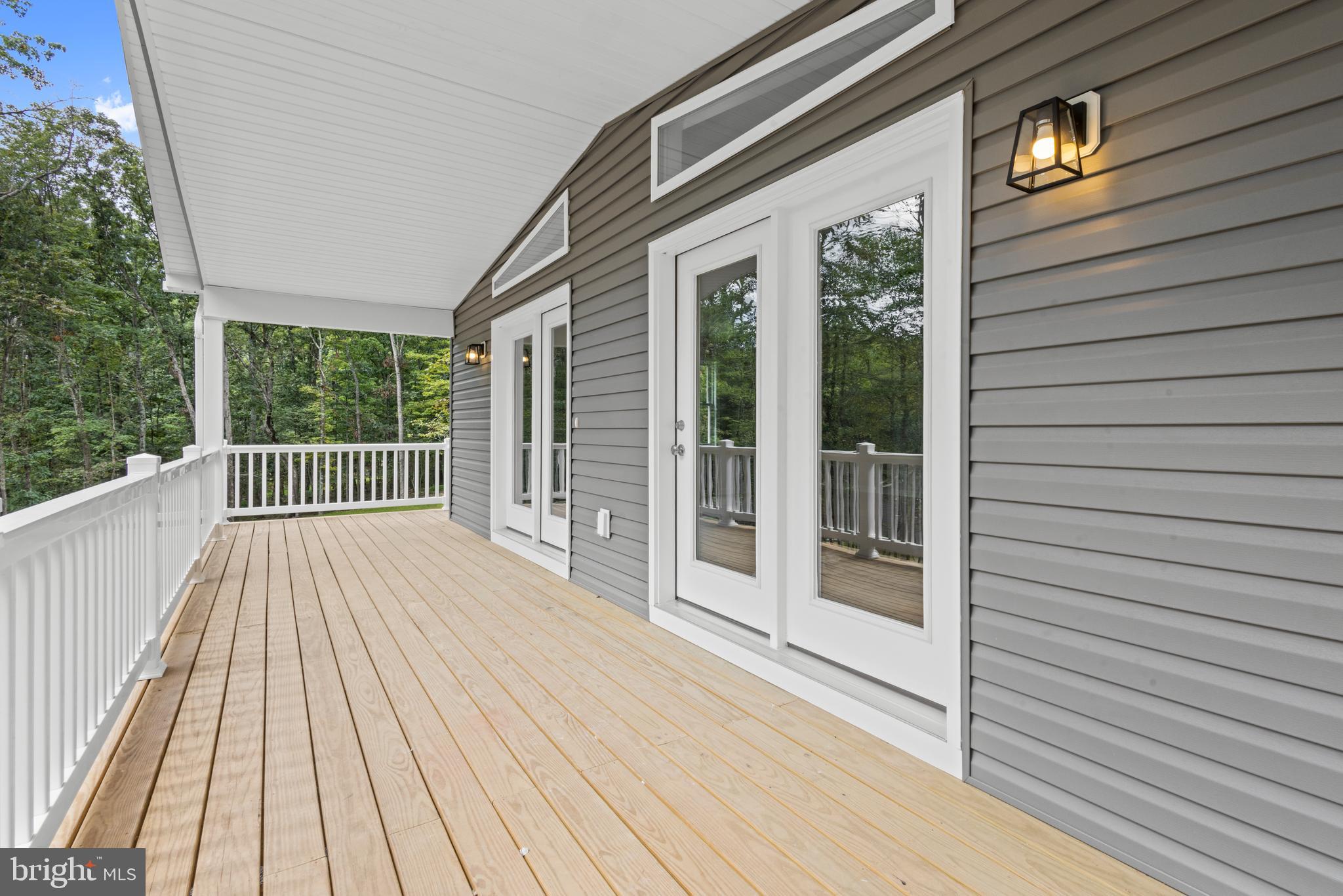 172 Martins Farm Road Front Royal, VA 22630 - Photo 16 of 22 a view of a balcony with wooden floor