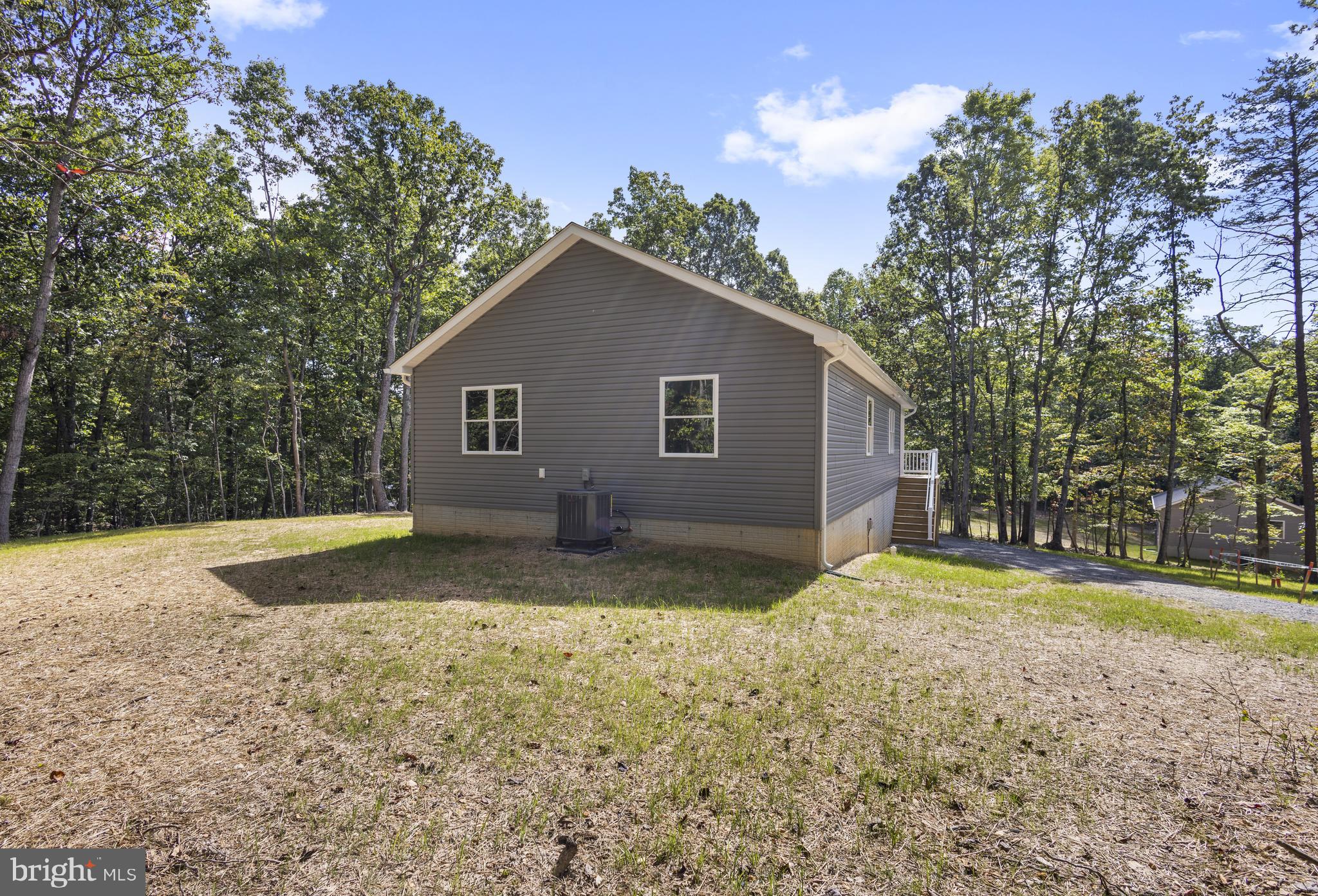 172 Martins Farm Road Front Royal, VA 22630 - Photo 18 of 22 a view of a yard in front of a house with large trees