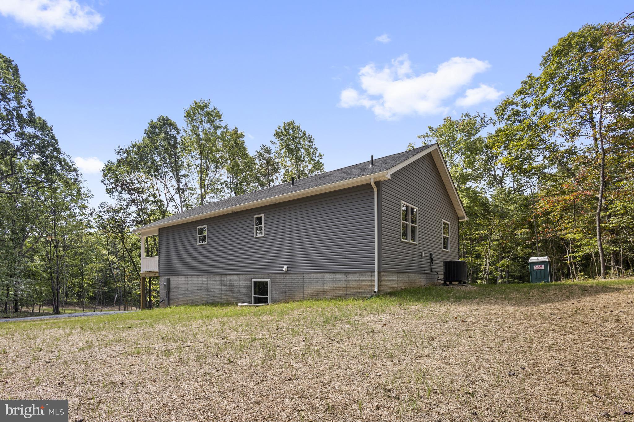 172 Martins Farm Road Front Royal, VA 22630 - Photo 19 of 22 a backyard of a house with lots of green space