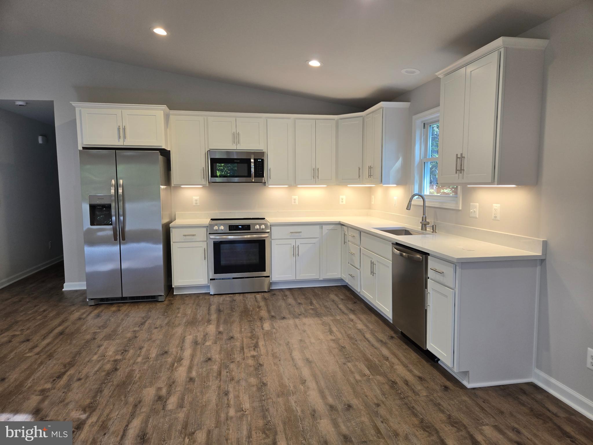 172 Martins Farm Road Front Royal, VA 22630 - Photo 2 of 22 a kitchen with stainless steel appliances a stove top oven a sink and a microwave