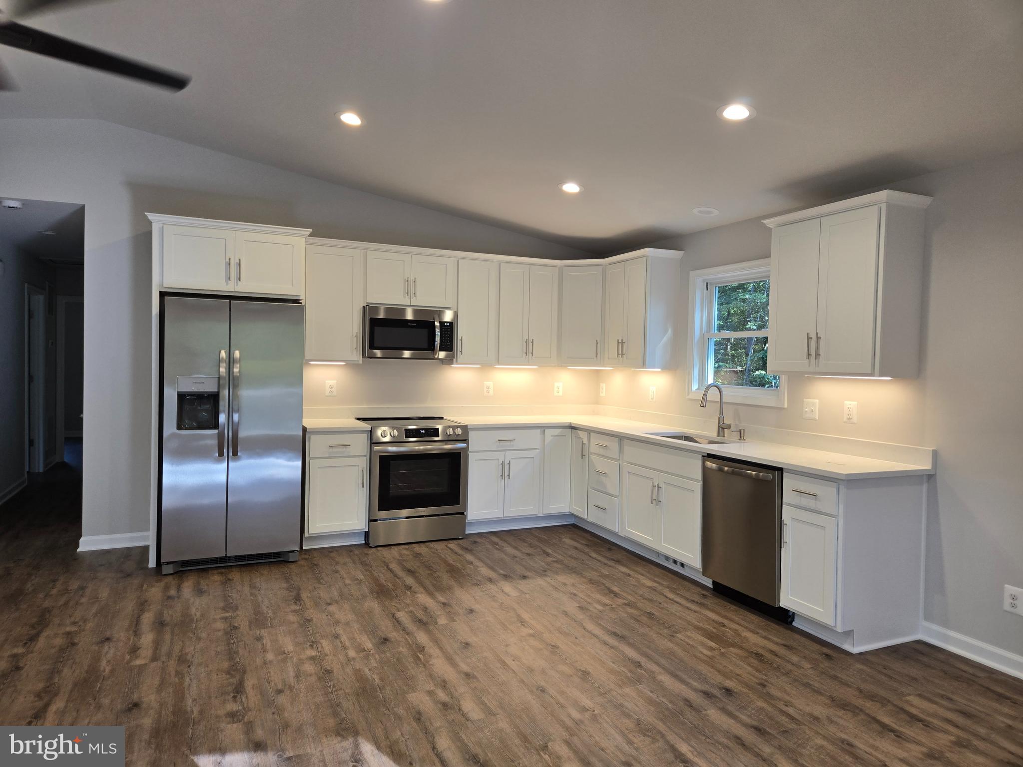 172 Martins Farm Road Front Royal, VA 22630 - Photo 22 of 22 a large kitchen with stainless steel appliances granite countertop a stove a sink and a refrigerator